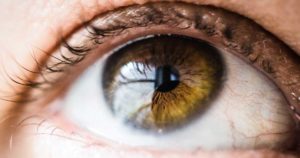 Close-up image of an eye looking upwards.