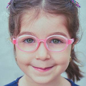 Little girl with pink glasses