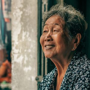 Senior woman looking out the window