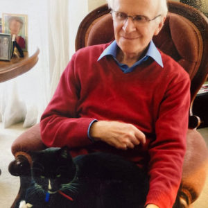 Ian Robertson at home with cat