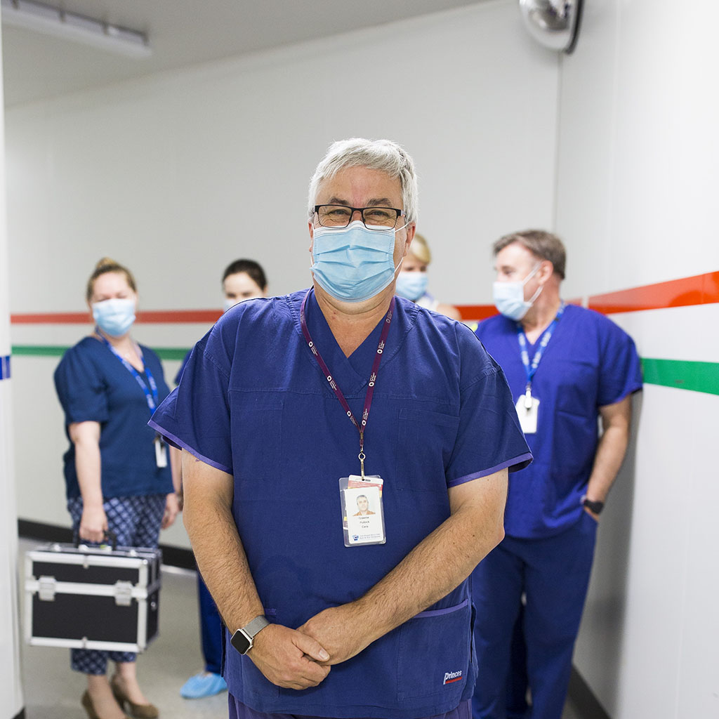 Dr Graeme Pollock OAM and the LEDS team in masks