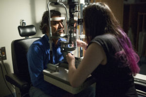Dr Flora Hui runs an eye test
