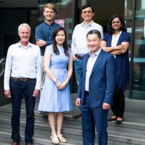 Photograph of some of the CERA's glaucoma researchers in front of the Royal Victorian Eye and Ear Hospital.