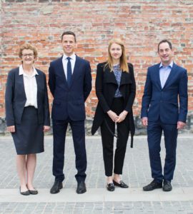 Photograph of members of CERA's Leadership Team, standing outdoors, face to camera.