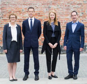 Photograph of members of CERA's Leadership Team, standing outdoors, face to camera.