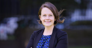 Photo of A/Prof Lauren Ayton, standing outside
