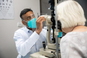 An ophthalmologist examining a patient using a specalised tool