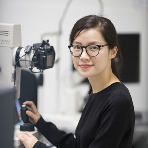 A head and shoulders photo of Dr Lisa Zhuoting Zhu in an eye clinic.