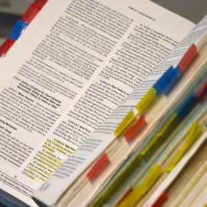 An open book that features lists and policies