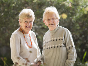 Jenny Turnbull and Janet Cliff, standing next to one another outside.