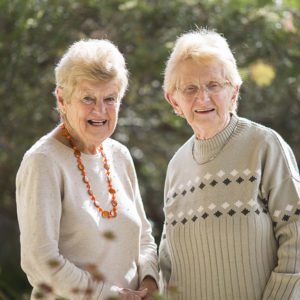 Jenny Turnbull and Janet Cliff, standing next to one another outside.
